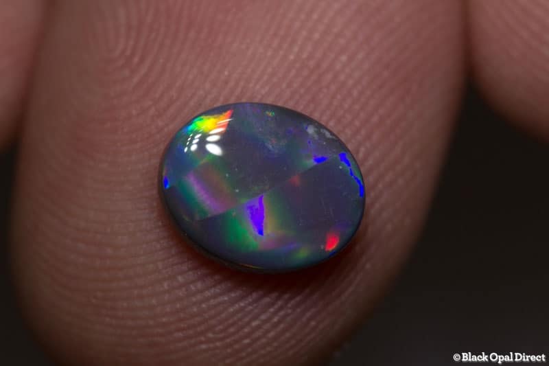 1.44 ct ribbon pattern black opal 9x7x3mm