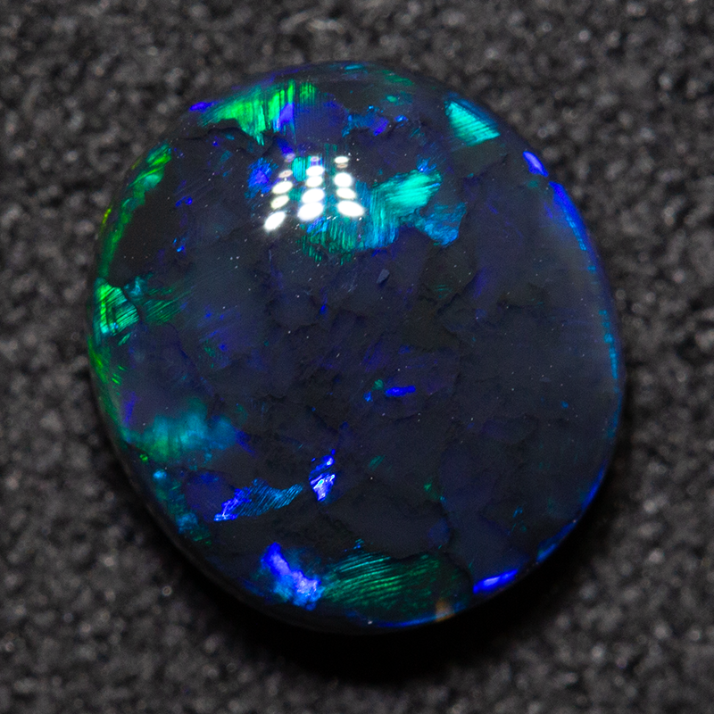 1.46 ct double-sided black opal 8.1x7.3x3.7mm