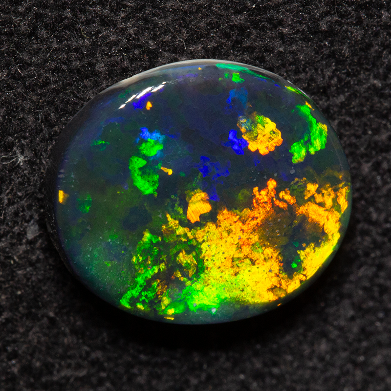 1.46 ct black opal 9.1x8.1x3.1mm