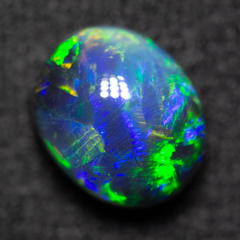 1.52 ct black opal 7.5x6.2x4.9mm
