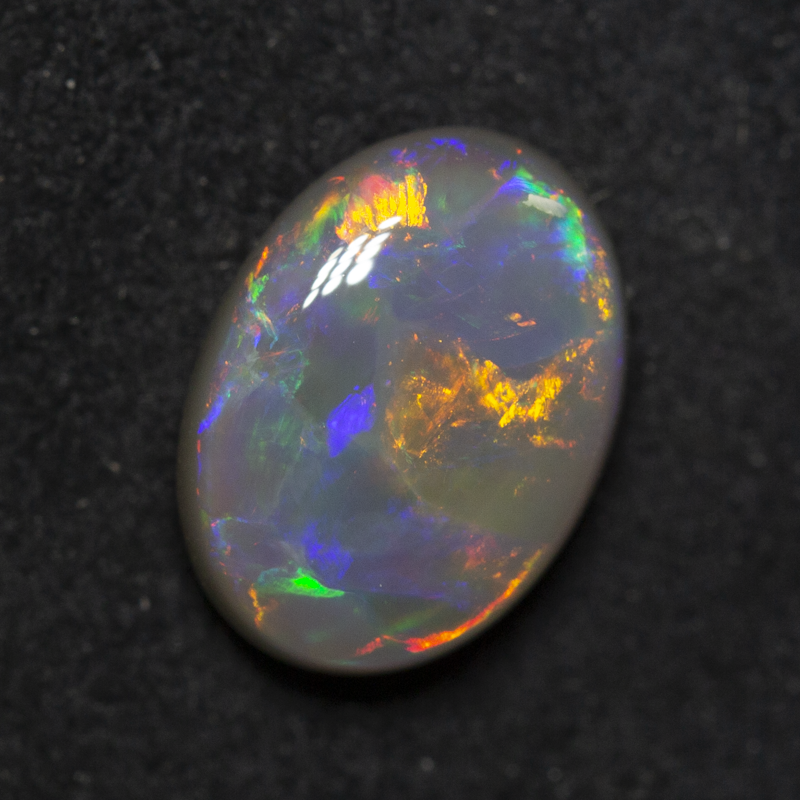 1.56 ct dark opal 9.6x7.1x3.6mm