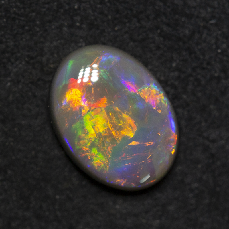 1.56 ct dark opal 9.6x7.1x3.6mm