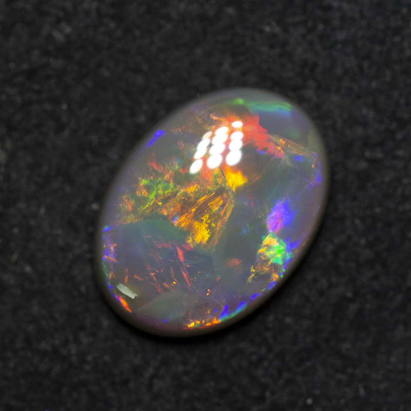 1.56 ct dark opal 9.6x7.1x3.6mm