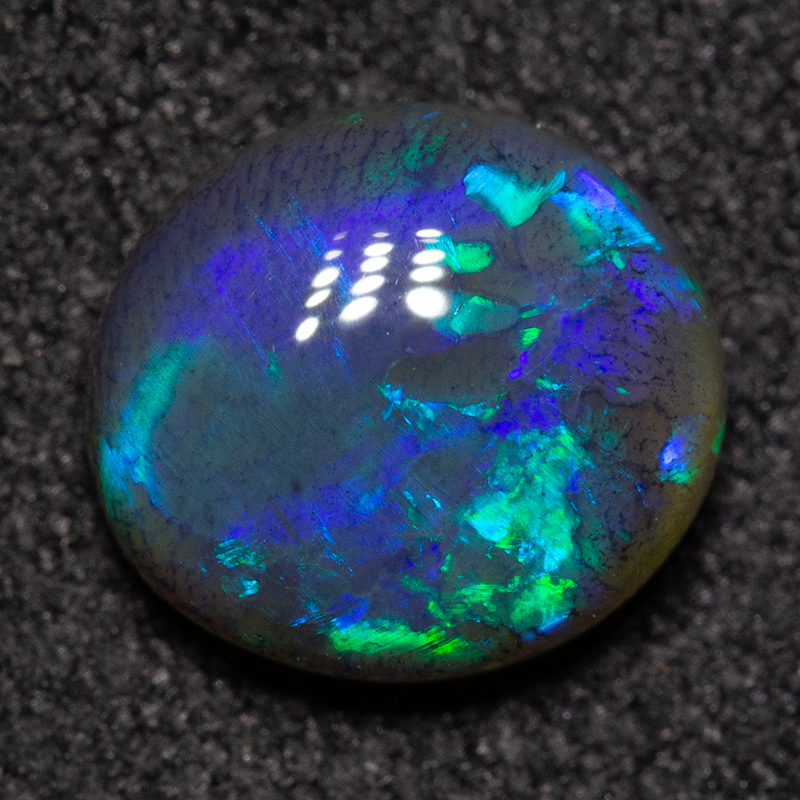 1.60 ct black opal 8.4x7.6x3.9mm