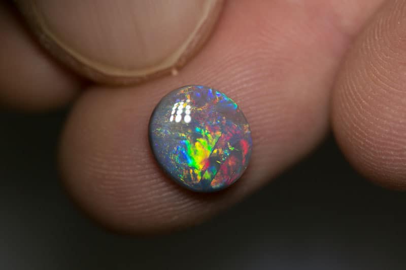 1.67 ct dark opal 10x9x2.5mm