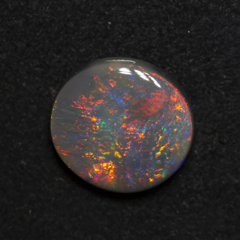 1.74 ct dark opal 9.1x8.4x3.5mm