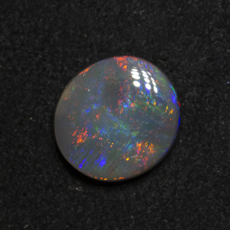 1.74 ct dark opal 9.1x8.4x3.5mm