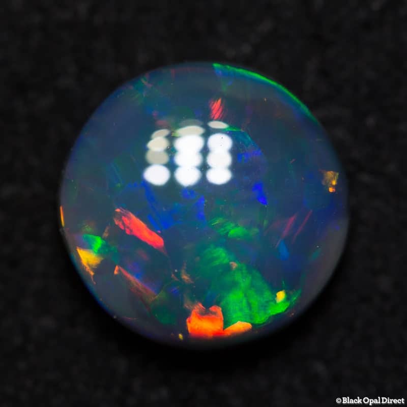 1.84 ct green red dark opal