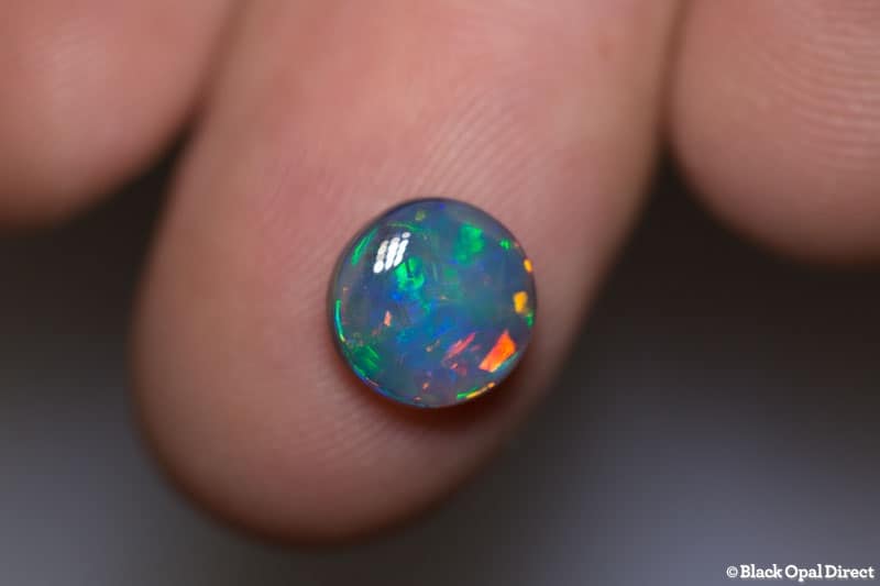 1.84 ct green red dark opal