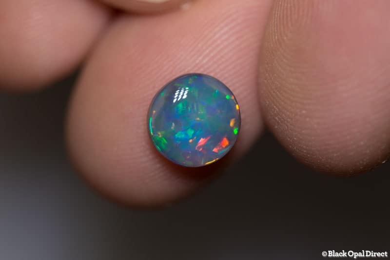 1.84 ct green red dark opal