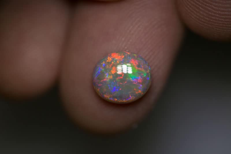 1.95 ct dark opal 9x8x3.5mm