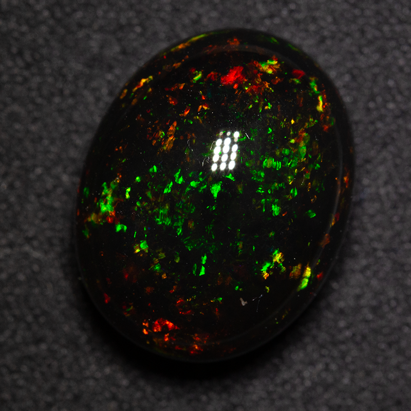 12.10 ct black opal 16.1x12.8x9.2mm
