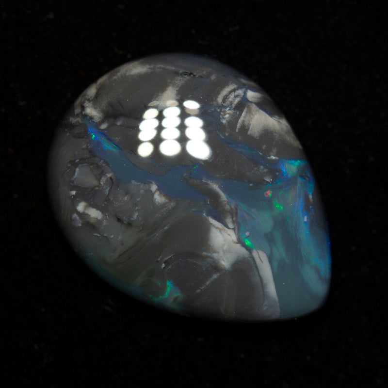 16.28 ct black opal 23.6x18.3x5.7mm