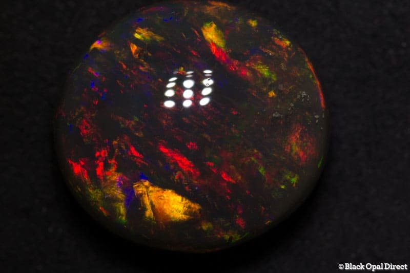 18.56 ct gem black opal 18x17x10mm