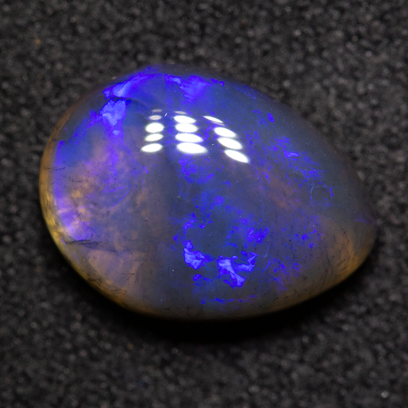 2.27 ct black crystal opal 10.9x8.1x4mm