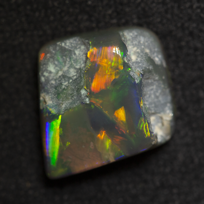 2.39 ct black opal carving 8.9x8.8x4.6mm