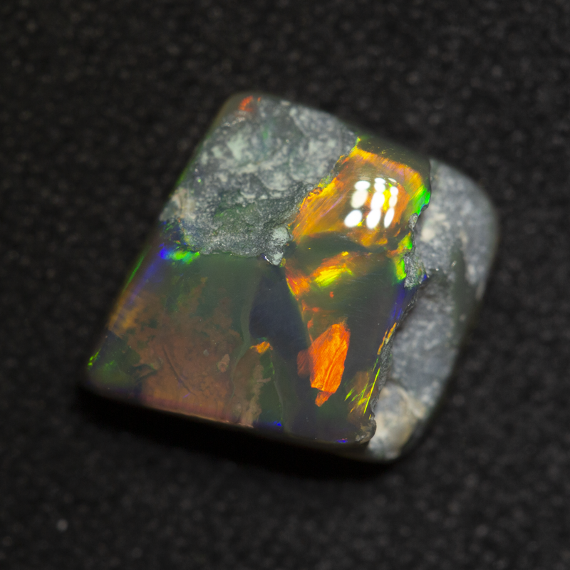 2.39 ct black opal carving 8.9x8.8x4.6mm