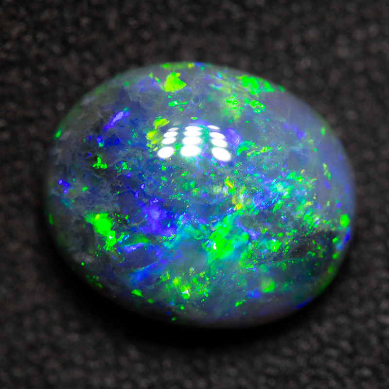 2.43 ct black opal 9.3x8x5mm