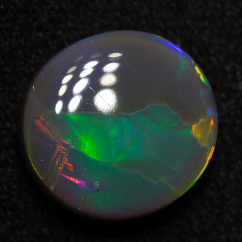2.44 ct dark opal 9.8x9.3x4.1mm