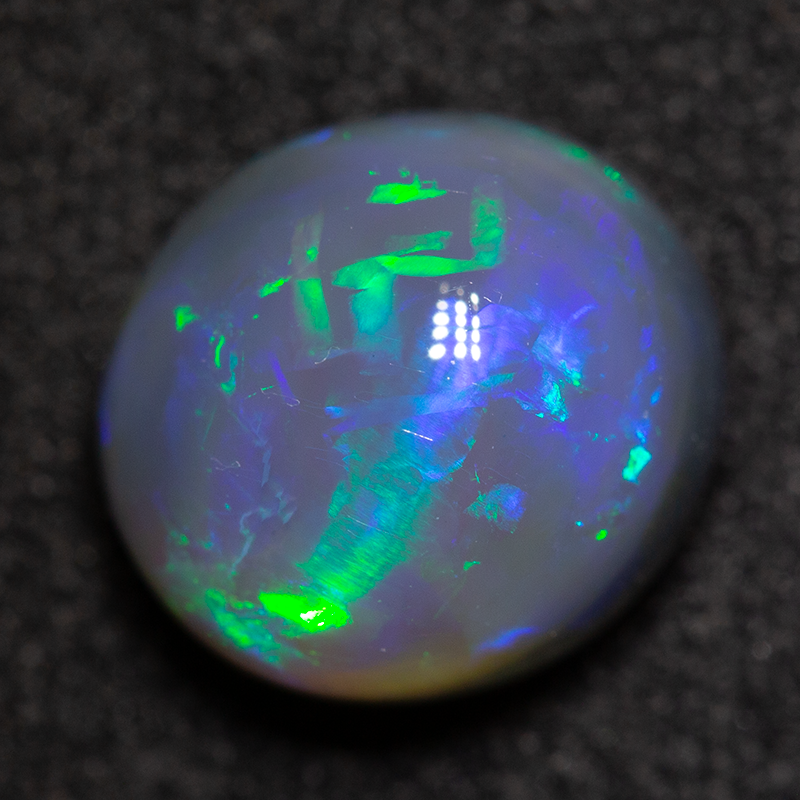 2.61 ct dark opal 9.1x8.3x6.1mm