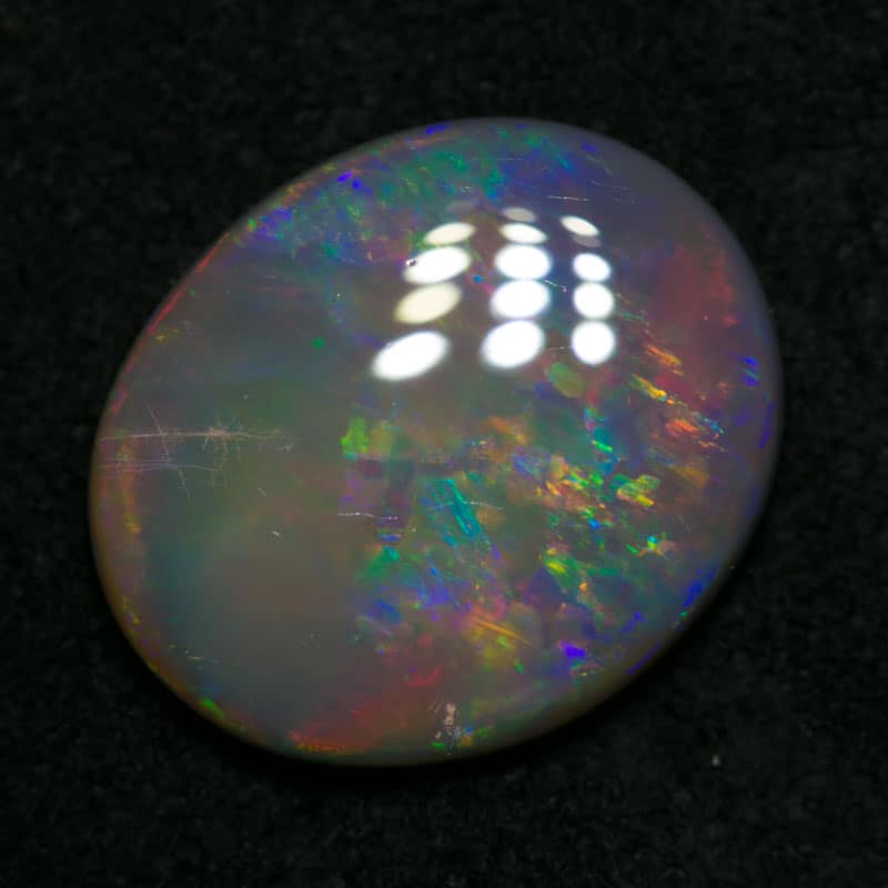 2.72 ct dark opal 12x10x3mm
