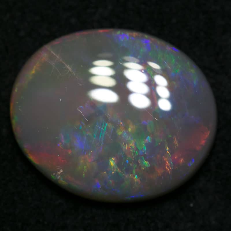2.72 ct dark opal 12x10x3mm