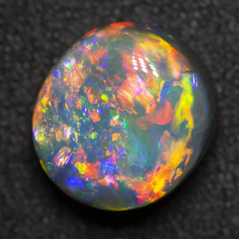 2.76 ct gem black opal 9.1x8.4x5.9mm