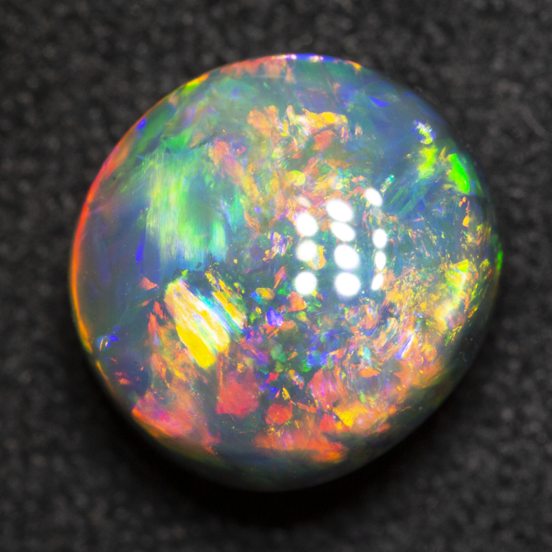2.76 ct gem black opal 9.1x8.4x5.9mm