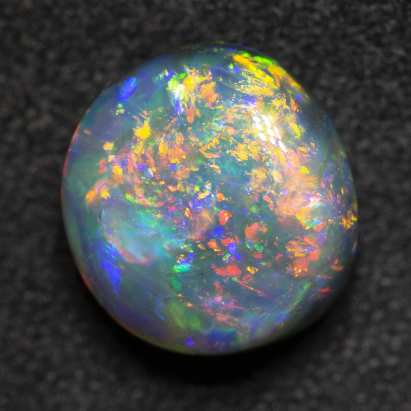 2.76 ct gem black opal 9.1x8.4x5.9mm