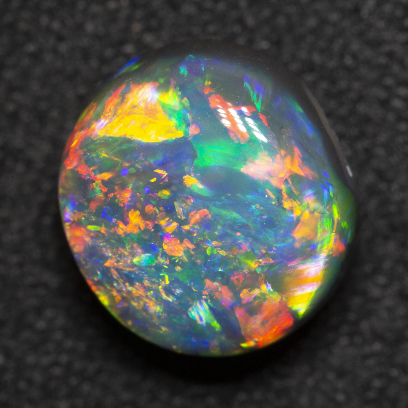 2.76 ct gem black opal 9.1x8.4x5.9mm