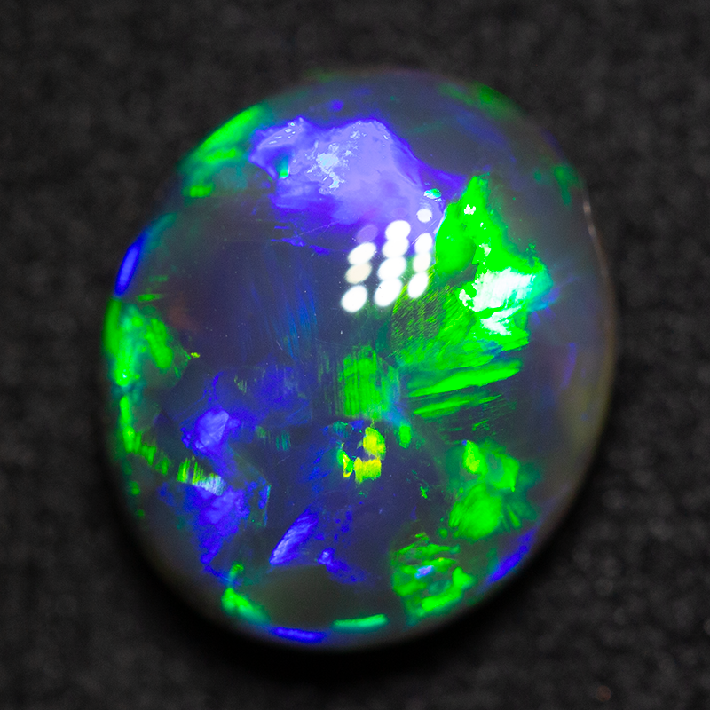 2.82 ct black opal 10.1x8.7x5.3mm