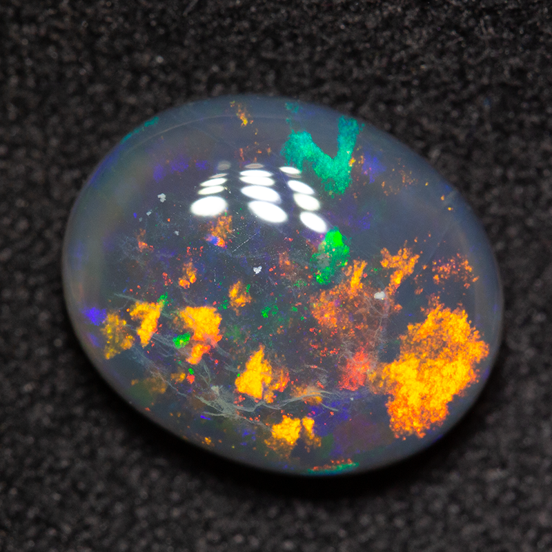 2.86 ct black opal 11x9x4mm