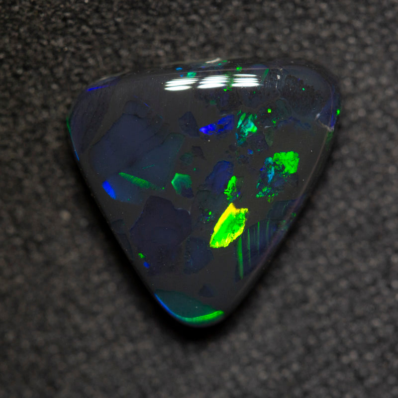 2.89 ct black opal 11.8x10.3x4.2mm