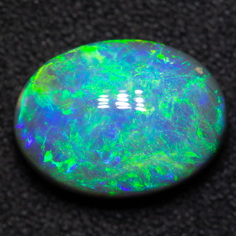 3.79 ct black opal 12x9x5.5mm