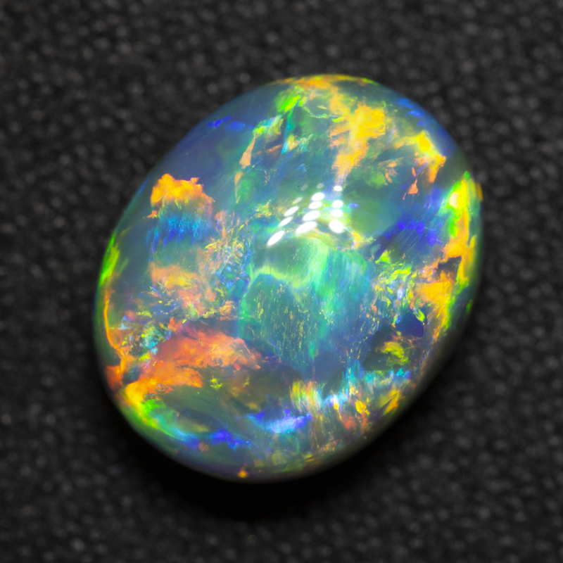 3.92 ct gem black opal 10.8x8.7x6.1mm