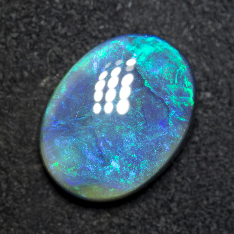 3.98 ct double-sided black opal 12.8x9.7x4.4mm