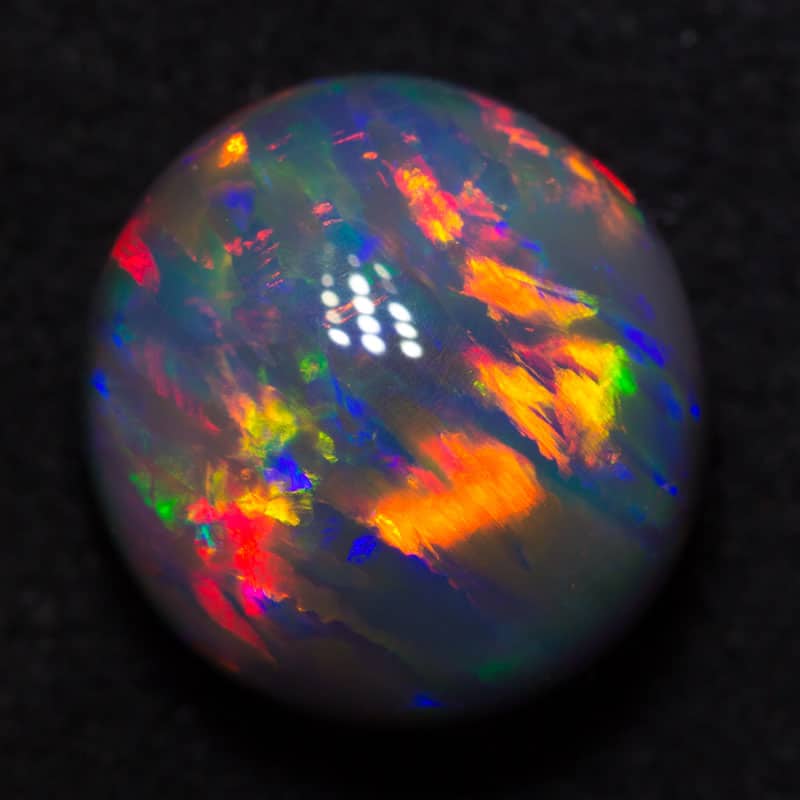 4.02ct gem black opal 10mm round x6mm