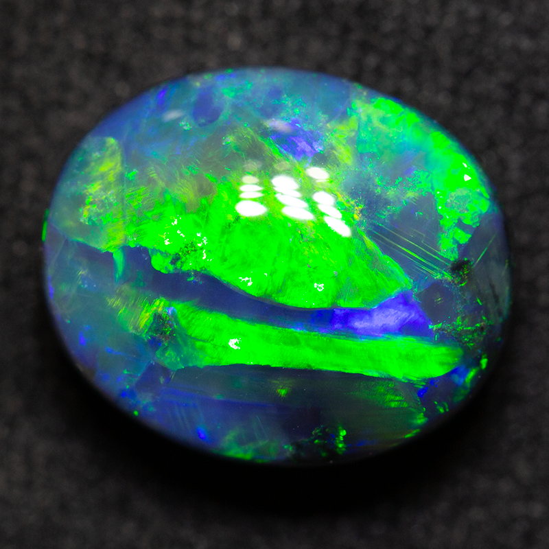 4.42 ct black opal 11.2x9.5x6.4mm