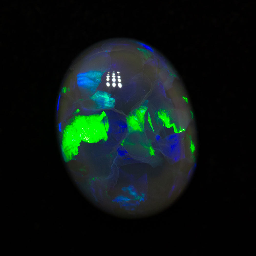 4.56 ct black opal 12.2x9.4x6.4mm