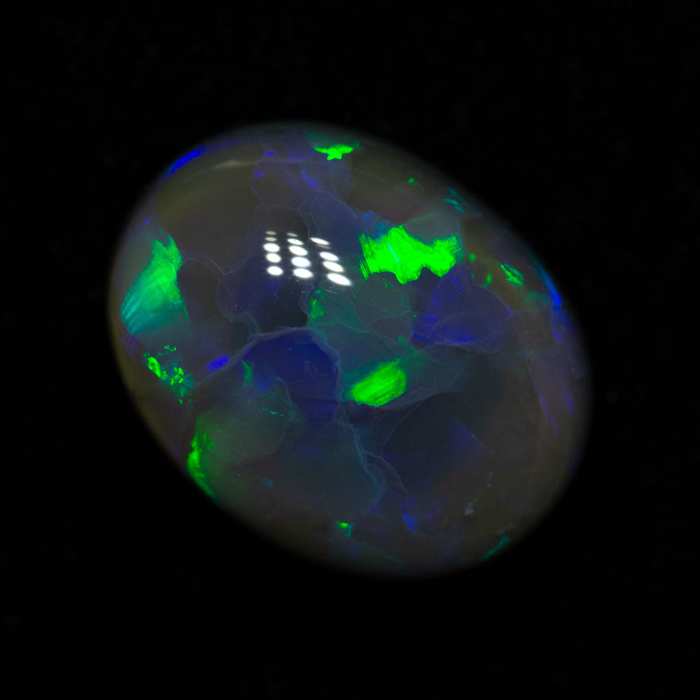 4.56 ct black opal 12.2x9.4x6.4mm