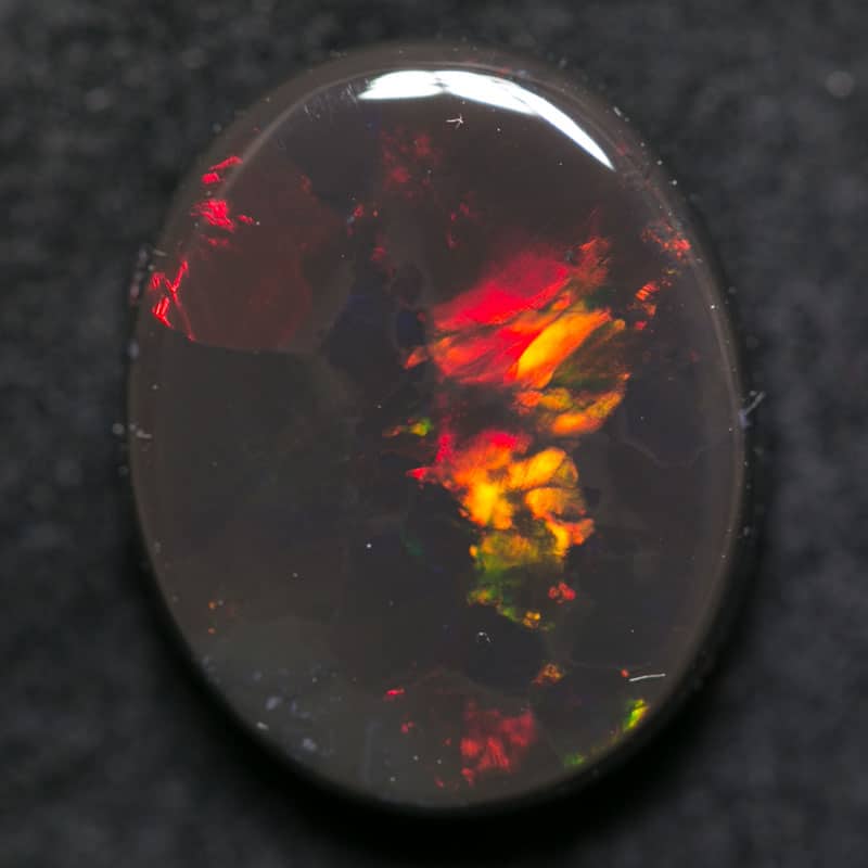 4.97 ct black opal 14x11x4.5mm