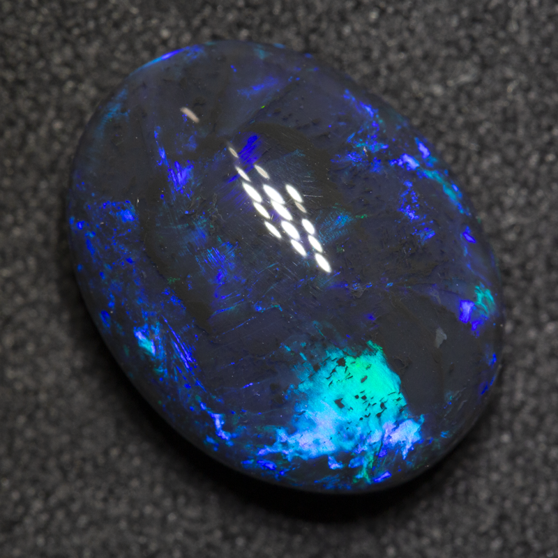 5.24 ct black opal 13.7x10.7x6.2mm