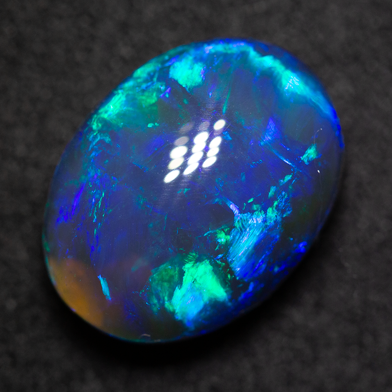 5.61 ct black opal 13.3x10.2x6.8mm