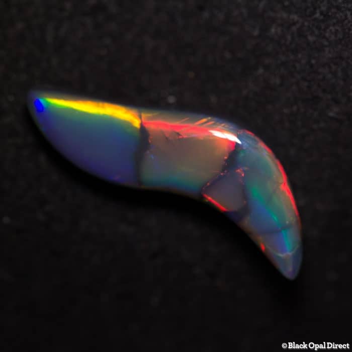 5.83 ct baroque gem black opal 23x8x6mm