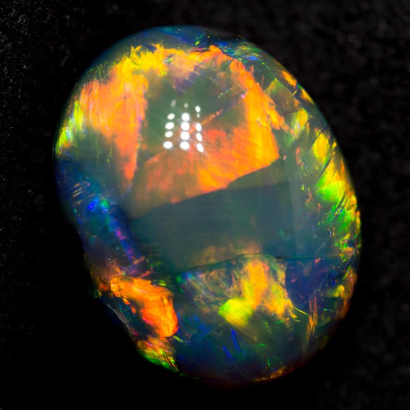 6.44 ct gem black opal 13.4x10.5x7.6mm