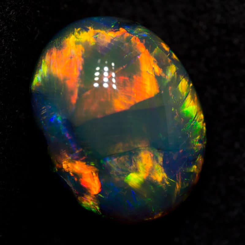 6.44 ct gem black opal 13.4x10.5x7.6mm