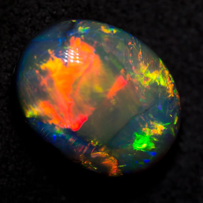 6.44 ct gem black opal 13.4x10.5x7.6mm