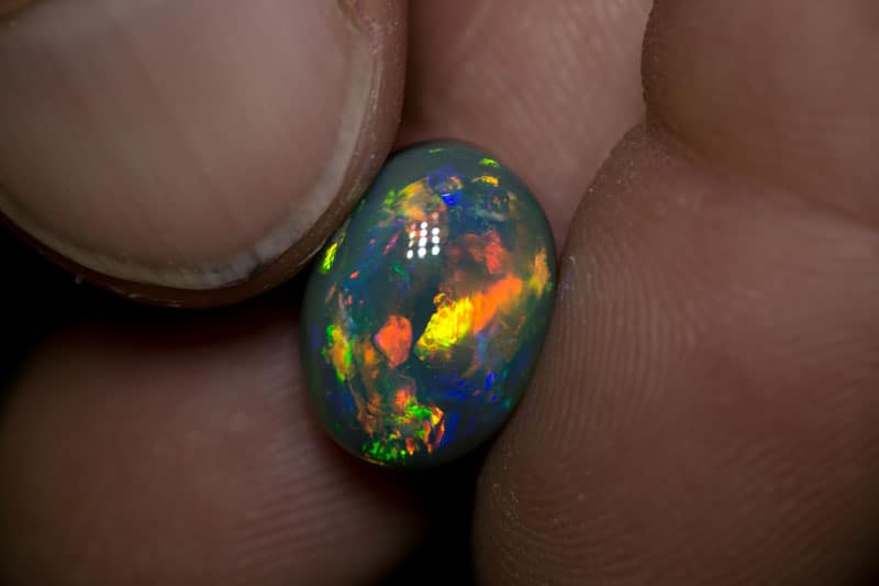 6.86 ct gem black opal 13.5x10x8mm
