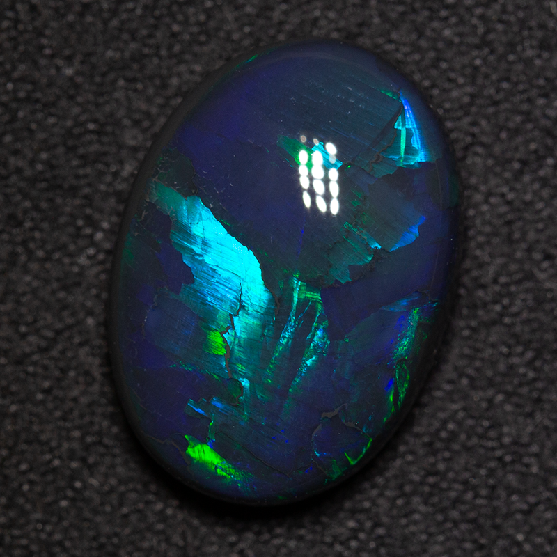 7.21 ct black opal 16x12x6mm