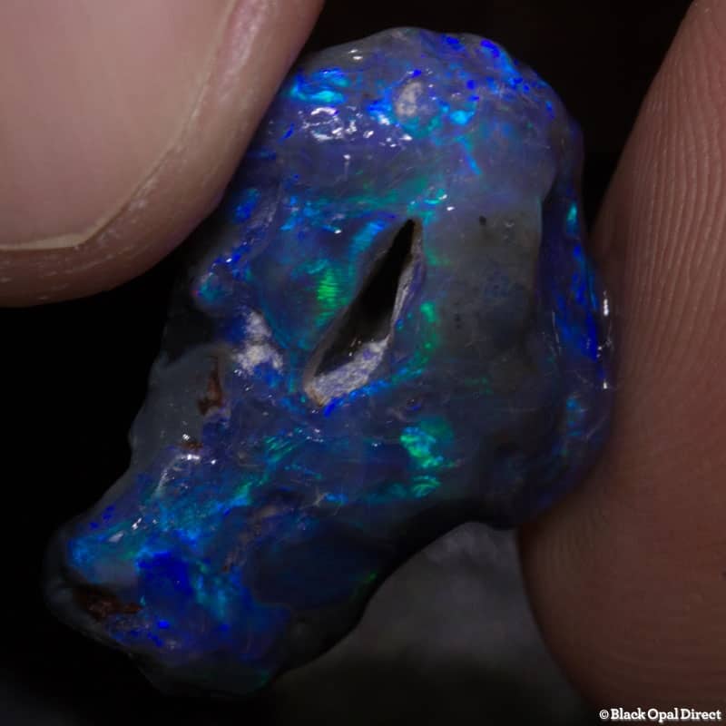 8.68 ct rough opal piece with hole 21mm across